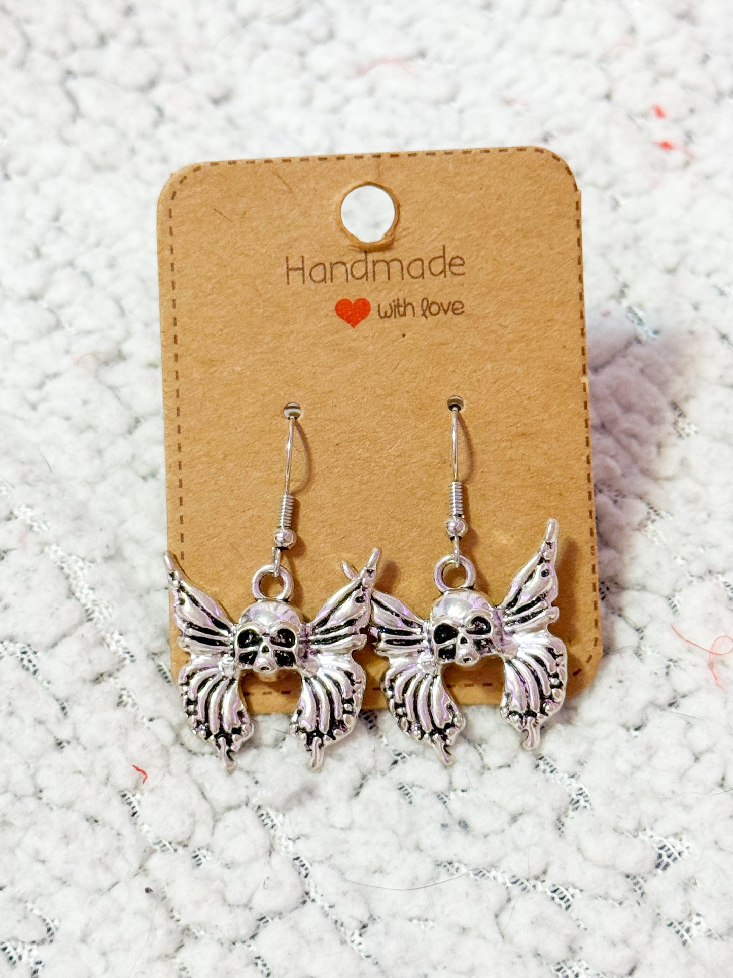 Butterfly skull earrings